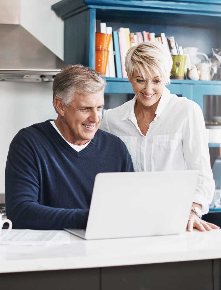 senior couple looking at account online